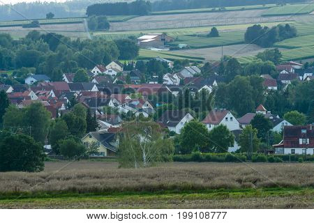 View of the small town of Neustadt (Marburg-Biedenkopf district in Hessen) a suburb and surrounding agricultural land.
