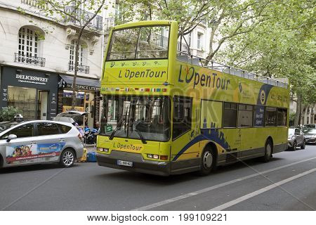 PARIJS , FRANKRIJK - JULY 23 ,2017: Tourist Bus in Paris, France  Paris Open Tour is a touristic bus service that shows the city with an audio guide.