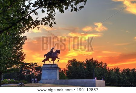 July 7 2017 - St. Louis Missouri - The sunset over the Apotheosis of St. Louis statue of King Louis IX of France namesake of St. Louis Missouri in Forest Park St. Louis Missouri.