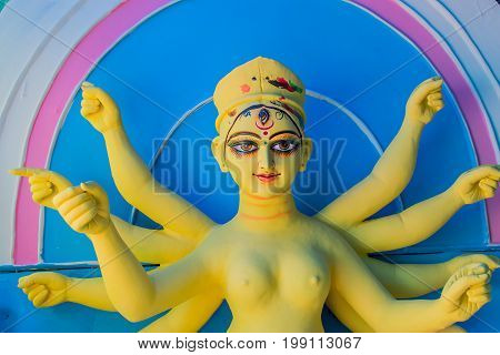 KOLKATA WEST BENGAL INDIA - 25 SEPTEMBER 2016: Clay idol of Goddess Durga under preparation for "Durga Puja' festival in Kumartuli Kolkata. Biggest festival of Hinduism.
