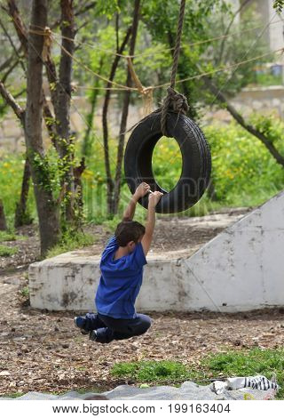 Children ride on impromptu swings
