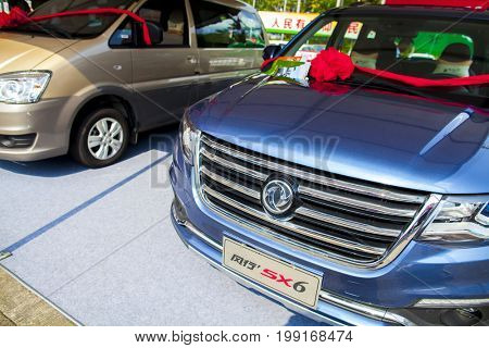 Dongguan, Guangdong, China - August 7, 2017: Dongfeng Chinese automobiles on display at Dongguan car exhibition awaiting prospective buyers
