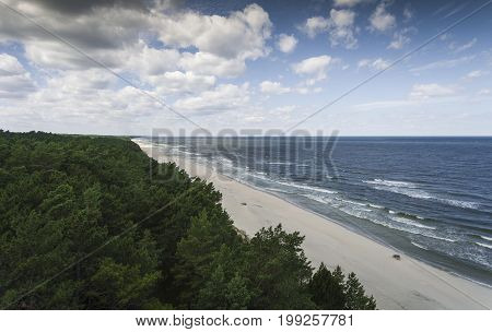 Aerial view of Baltic sea shore and forest near Krynica Morska in Poland.
