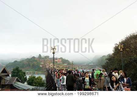 5 January 2017 : tourists on wooden Mon Bridge, Sangkhla Buri, Kanchanaburi, Thailand