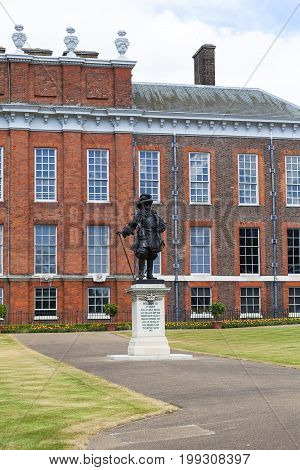 LONDON UNITED KINGDOM - JUNE 23 2017: Statue of William III in front of Kensington Palace in Kensington Gardens. It has been a residence of the British Royal Family since the 17th century and Queen Victoria's birthplace