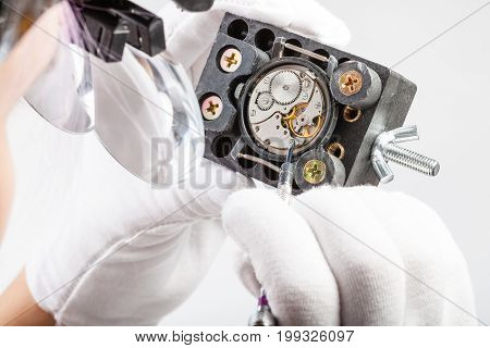 Watchmaker In Magnifying Glasses Repairs Old Watch