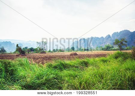Rural landscape. Fields in season Natural rocky mountains