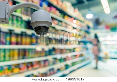 Security camera monitoring on the Abstract blurred photo of store in department store bokeh background business shopping base on security concept