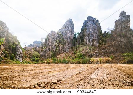 Rural landscape. Fields in season Natural rocky mountains
