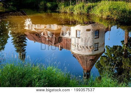 Jaunpils Castle is a fortified castle in the historical region of Zemgale, in Latvia. Reflection in the pond