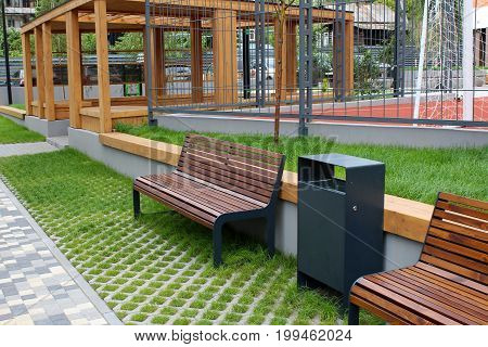Park Bench In A Spring Garden.