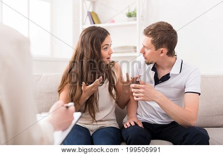 Young couple conflict at therapy session. Relationship problems, family issues concept