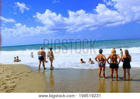 July, 2017 - Vacationers bathe in the sea and sunbathe in the sun on Cleopatra Beach (Alanya, Turkey).
