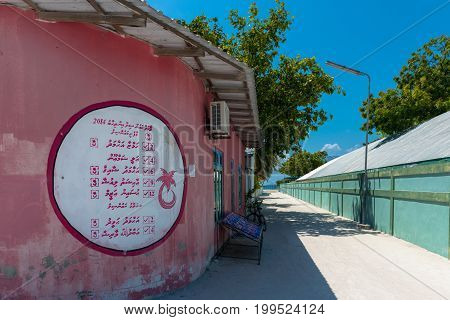 MAAFUSHI MALDIVES - MARCH 02 2016: Horizontal picture of Local market with pink wall at Maafushi in Maldives.