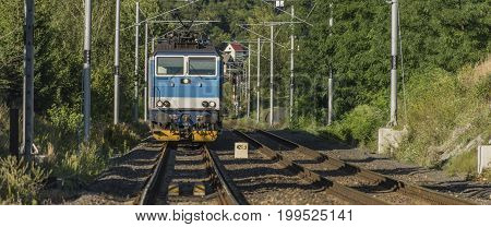 Fast train near bridge in Labe river valley in summer afternoon