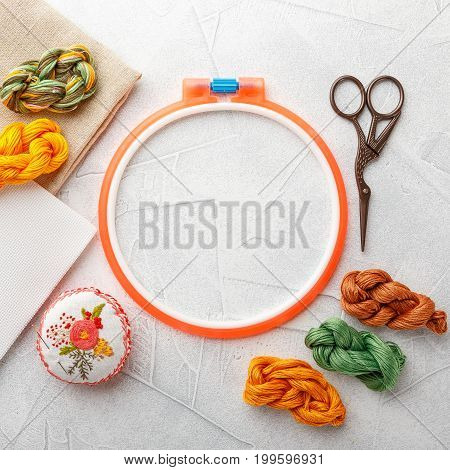 Set for embroidery embroidery hoop linen fabric thread scissors embroidered needle bed. Top view