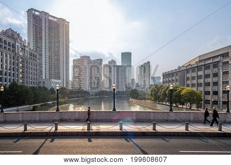 Shanghai, China - Nov 6, 2016: Along Xizang Middle Road, crossing the Wusong or Suzhou River. Image captured from a public bus.