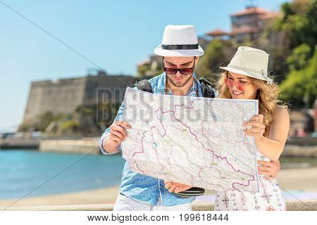 Couple tourist traveling and using map. Couple tourist exploring a city
