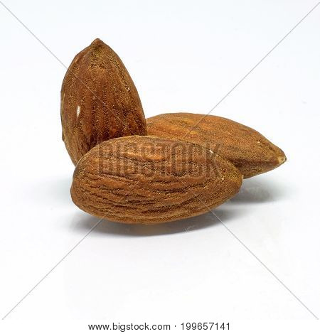 Selective focus on Almonds isolated on white background.