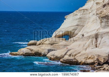 Rocks of white limestone form arches and grottoes on the shores of the Mediterranean Sea. The grottoes of Rosh Ha Nikra. Geological phenomenon in the north of Israel