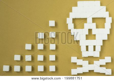 The skull made from sugar cubes. Sugar Kills. Red background. diabetes concept. Suggesting dieting concept. Unhealthy white sugar concept. Copy space. Space for text.
