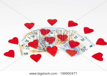 Red heart on euro banknotes bills. On white background. love and money