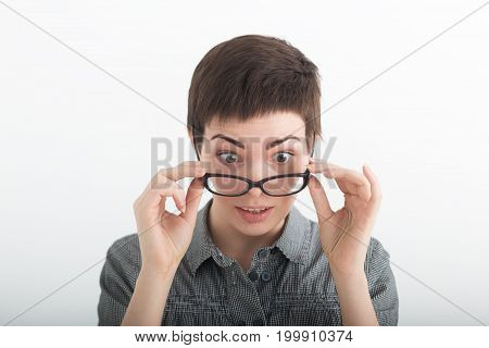 Shock and disbelief concept. Surprised astonished girl with wide open mouth. Amazed female looking very shocked. Facial expression and body language