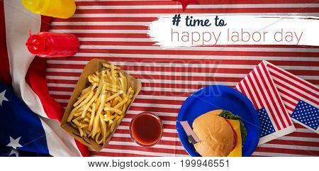 Digital composite image of time to happy labor day text against overhead view of french fries ad burger on tablecloth