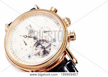 watch with visible mechanism on white.  men's accessory and time management concept.