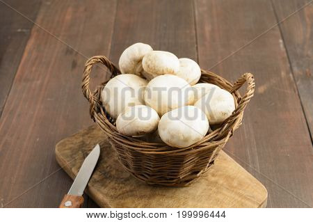 A Basket Of Champignion And Knife