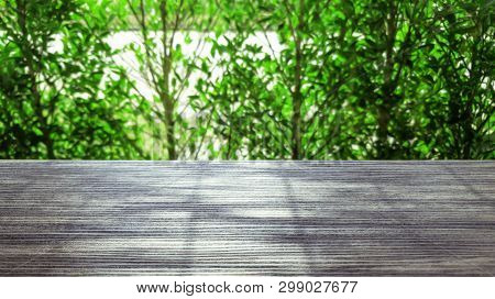Top Of Wooden Table With Blurred Green Nature Background, Empty Wooden Board With Bokeh Nature Backg