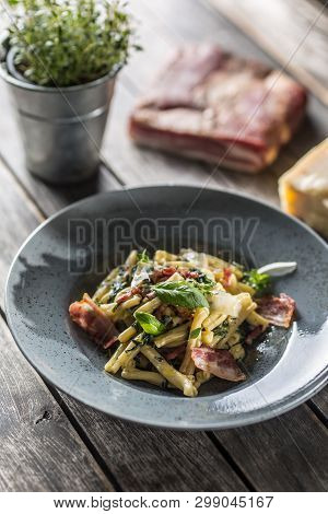 Pasta Casarecce With Bacon Pancetta Parmesan Cheese And Herbs Basil. Italian Or Mediterranean Cuisin