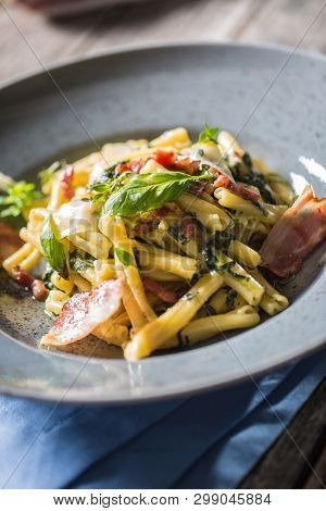 Pasta Casarecce With Bacon Pancetta Parmesan Cheese And Herbs Basil. Italian Or Mediterranean Cuisin