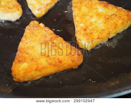 Triangular Roesti Corners Fried In The Pan Darkly