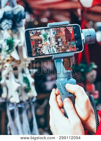 Germany, Nuremberg - December 17, 2018: Close-up Of Man Blogger Hands Shooting Video On Smartphone I