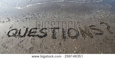 Questions With Question Mark Written On The Beach