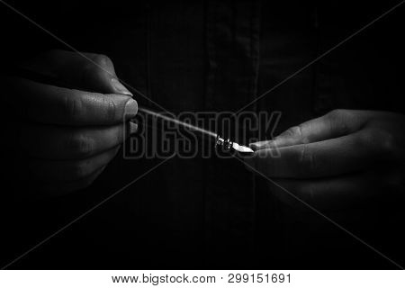 Female Hand Elegantly Holding An Ink Pen With A Metal Tip Close-up On A Black Background. Classic Fo