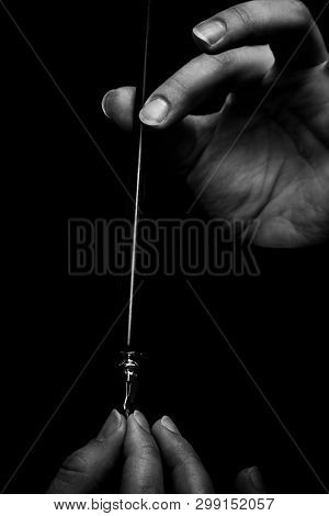 Female Hand Elegantly Holding An Ink Pen With A Metal Tip Close-up On A Black Background. Classic Fo