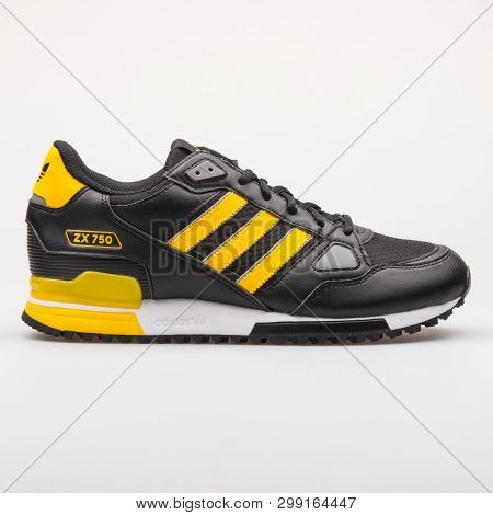 Vienna, Austria - August 23, 2017: Adidas Zx 750 Black And Yellow Sneaker On White Background.