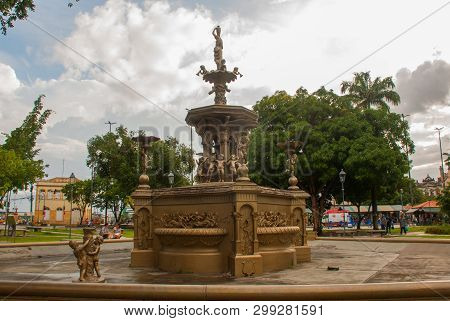 Beautiful Fountain With Angels Near The Temple. Matriz Church In Portuguese Igreja Matriz, Manaus Am