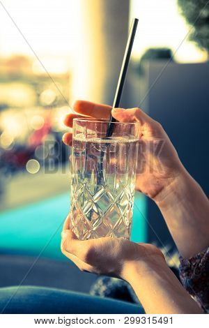 Refreshing Drink In The Summer: Girl Is Holding Glass With Cold Beverage