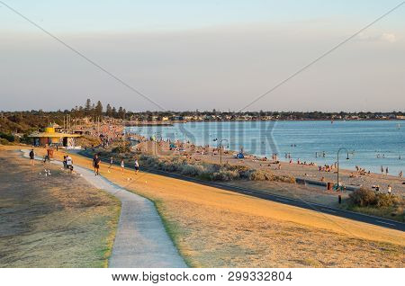 Melbourne, Australia - March 2, 2019: People On The Sand And In The Water At Elwood Beach In The Inn