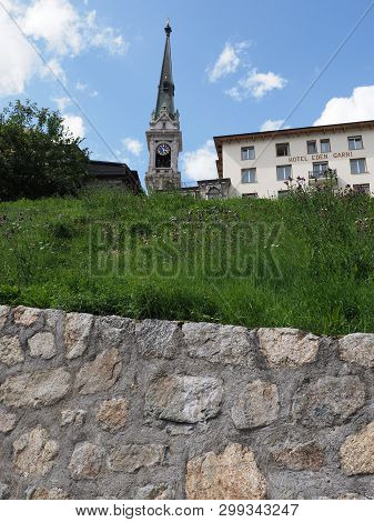St. Moritz, Switzerland On August 2018: Clock Tower Of Evangelische Kirke, Protestant Church And Hot