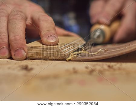 The Process Of Making A Classical Guitar. Remove Excess Glue After Gluing The Tailblock.
