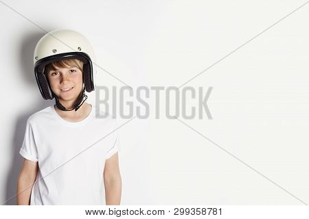 Happy Young Cute Cheerful Teen Boy In White Tshirt Draming To Ride A Motorcycle Isolated On White Ba