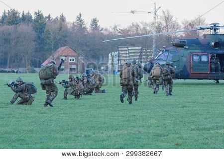 Olst Feb 13 2018: Amry And Air Force Helicopter Exercise. Cougar Picking Up Soldiers
