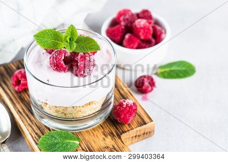 No Baked Cheesecake With Raspberry In Glass Jar. Healthy Dessert.