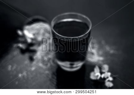 Ayurvedic Herb Brahmi Or Waterhyssop With Its Herbal And Beneficial Extract  In A Transparent Glass