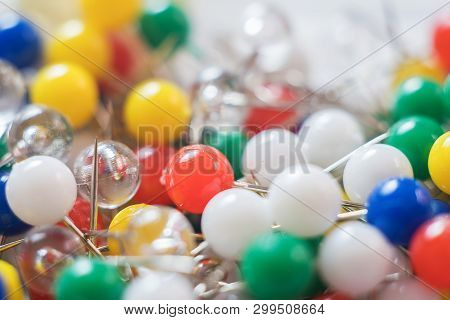 Close Up Of Colorful Thumbtacks Abstract Background