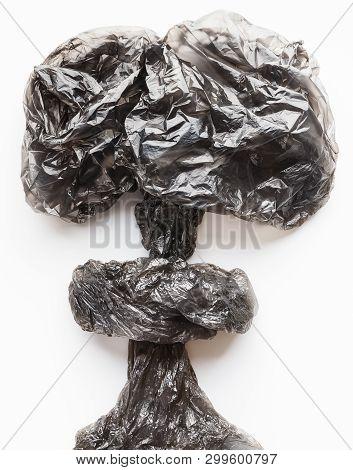 Crampled Black Plastic Bags In Nuclear Explosion Shape On White Background. Stop Ecological Catastro